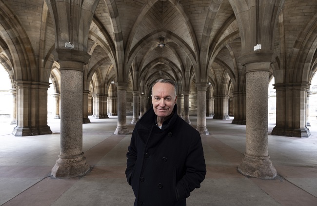 Andrew O'Hagan in the University of Glasgow's cloisters. Photo credit Martin Shields